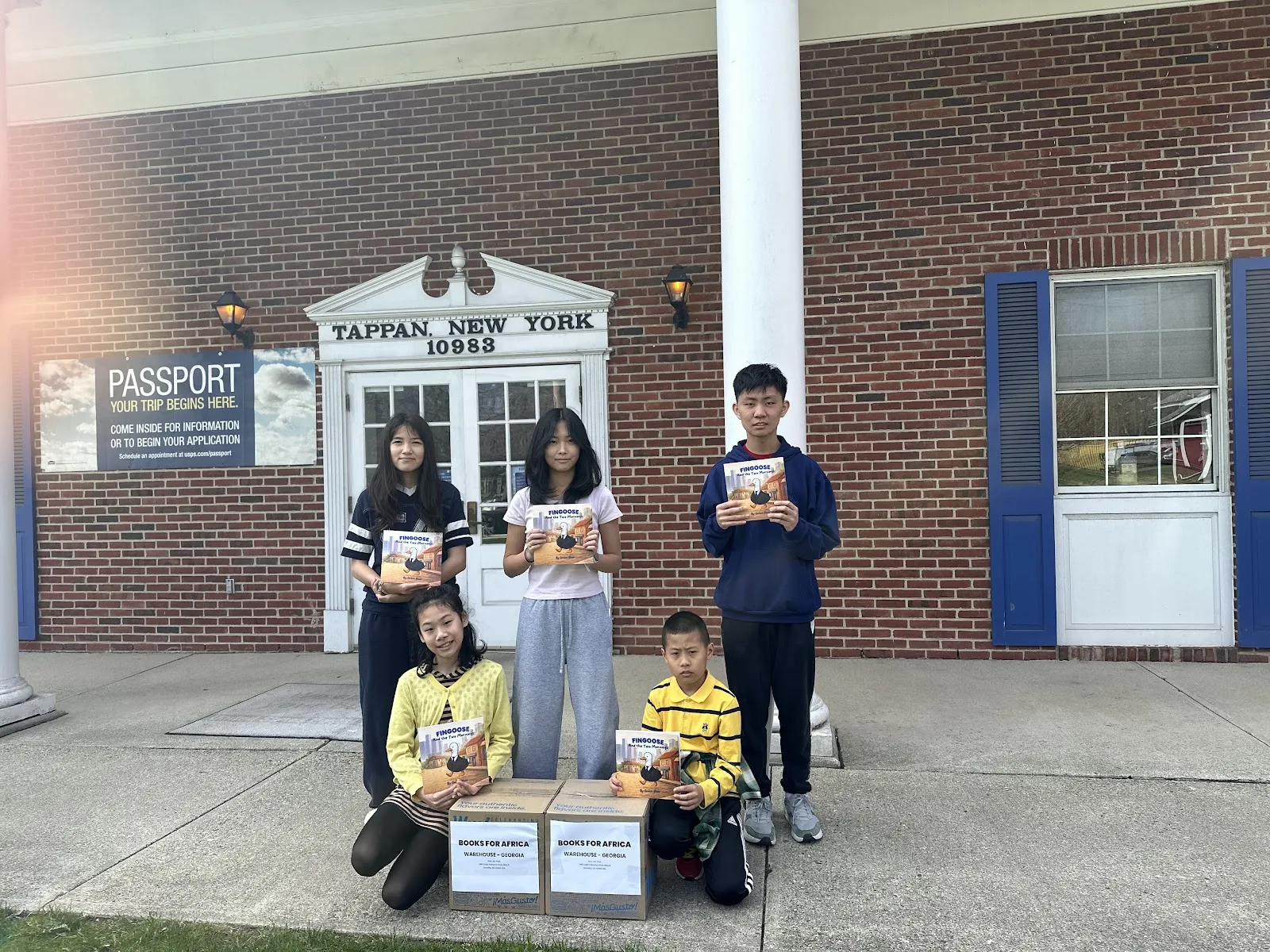 FinGoose book donation group outside the school