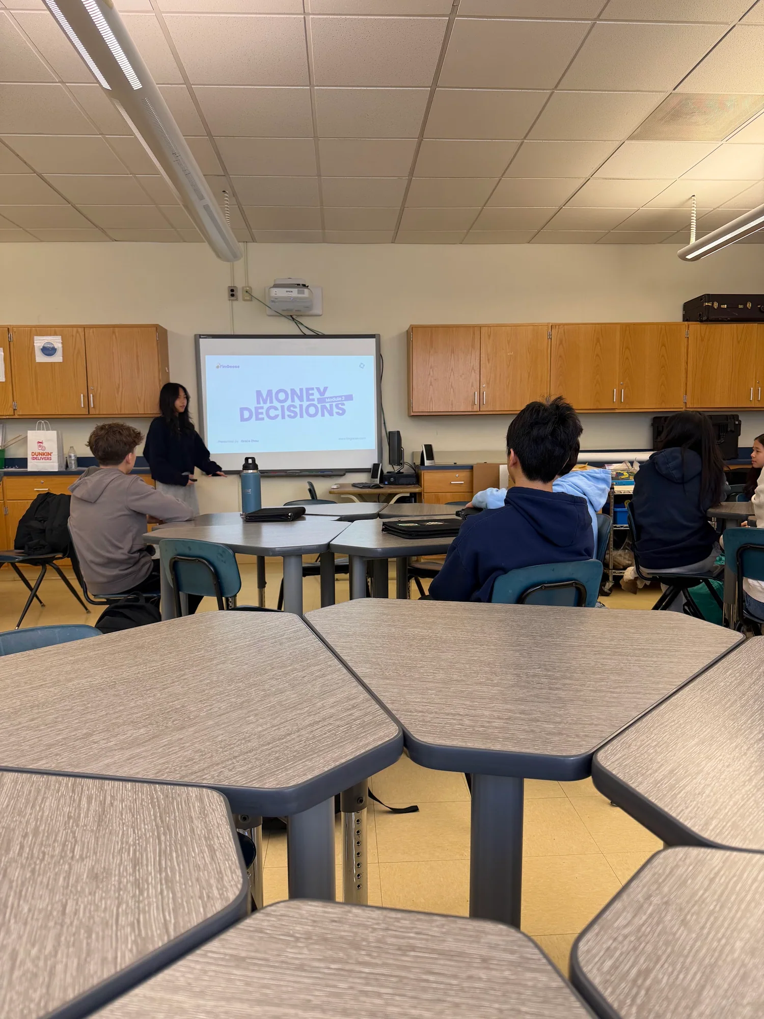 Students practicing money decisions during a FinGoose workshop