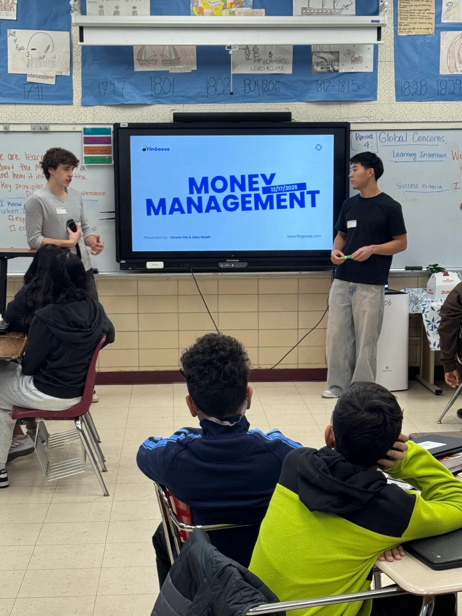 Students presenting a money management lesson